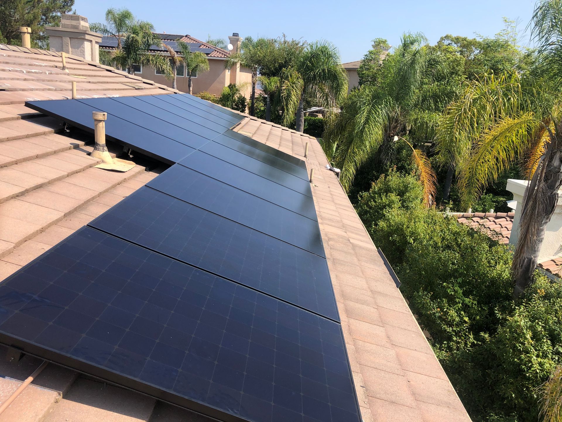 A roof with a lot of solar panels on it