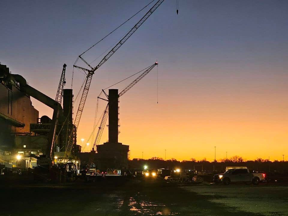factory exterior lights at sunset
