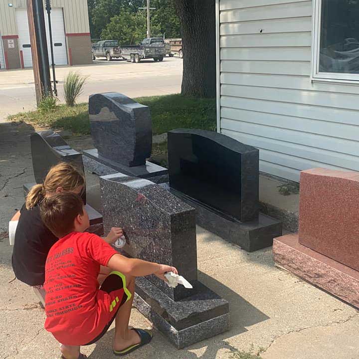 Kids Wiping the Monument — Mount Ayr, IA — Eighmy Friedrich Monument Co