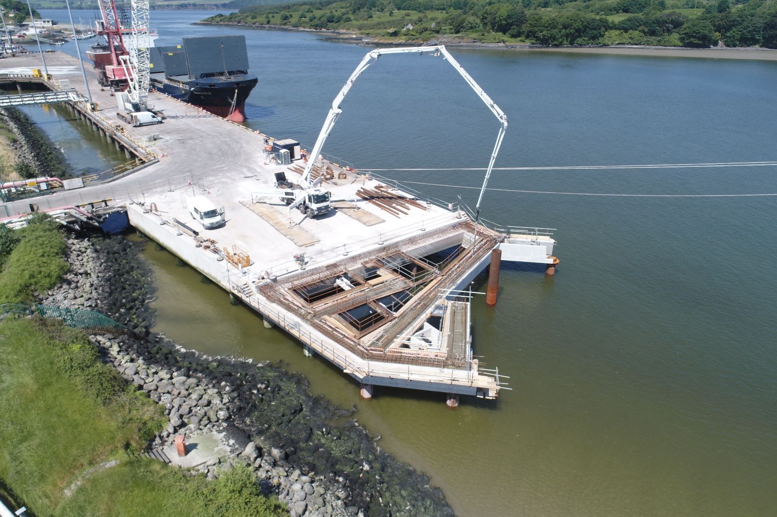 An aerial view of a bridge under construction in the water