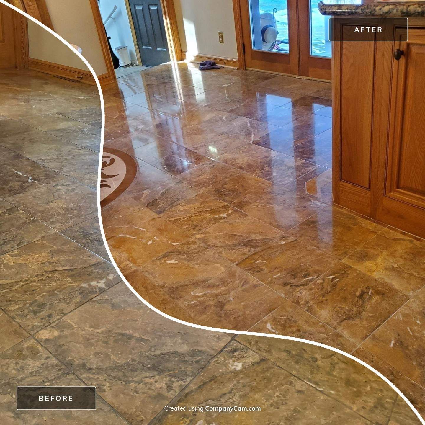 Empty room with stone-pattern tile floor and large windows overlooking trees