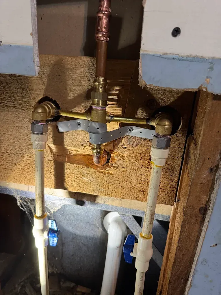 A bathroom sink with a drain pipe underneath it.