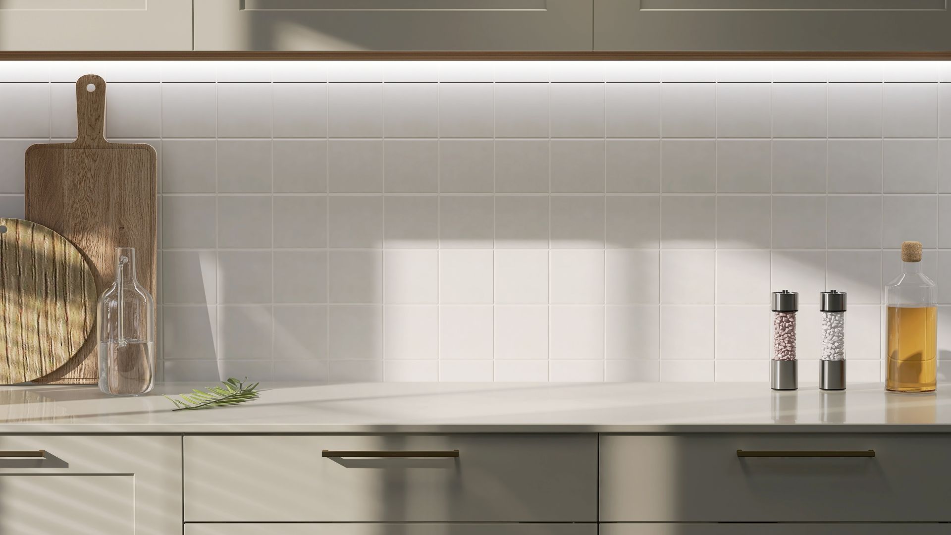 A kitchen with stainless steel appliances and white cabinets