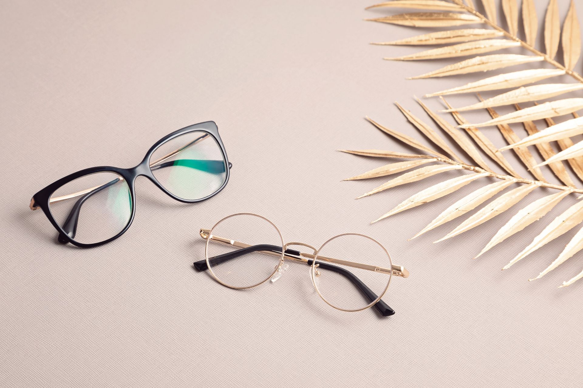 stylish eyeglasses over pastel background