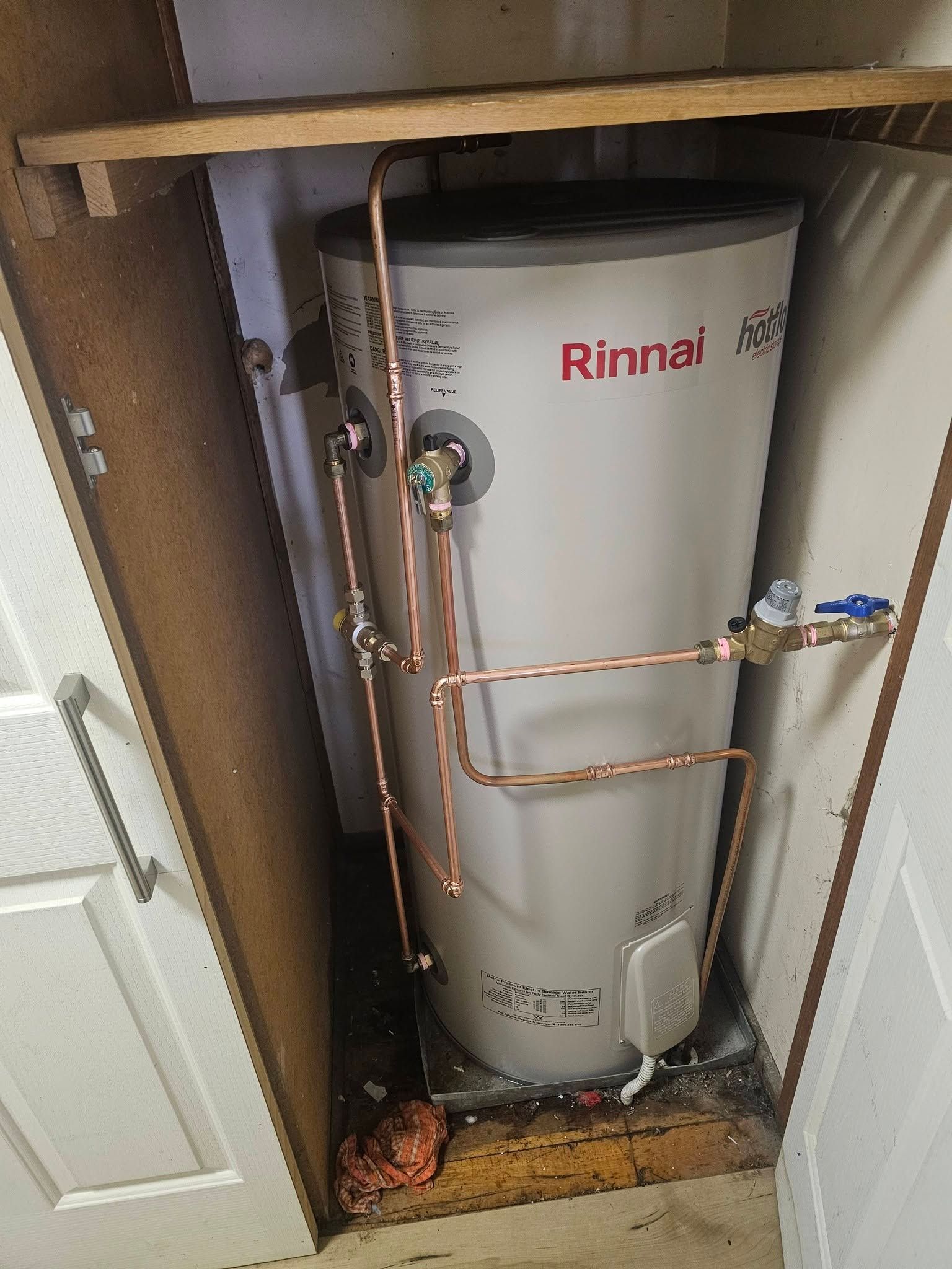Rinnai Water Heater in A Closet, with Copper Pipes — Lenny's Plumbing & Contracting in Granton, TAS