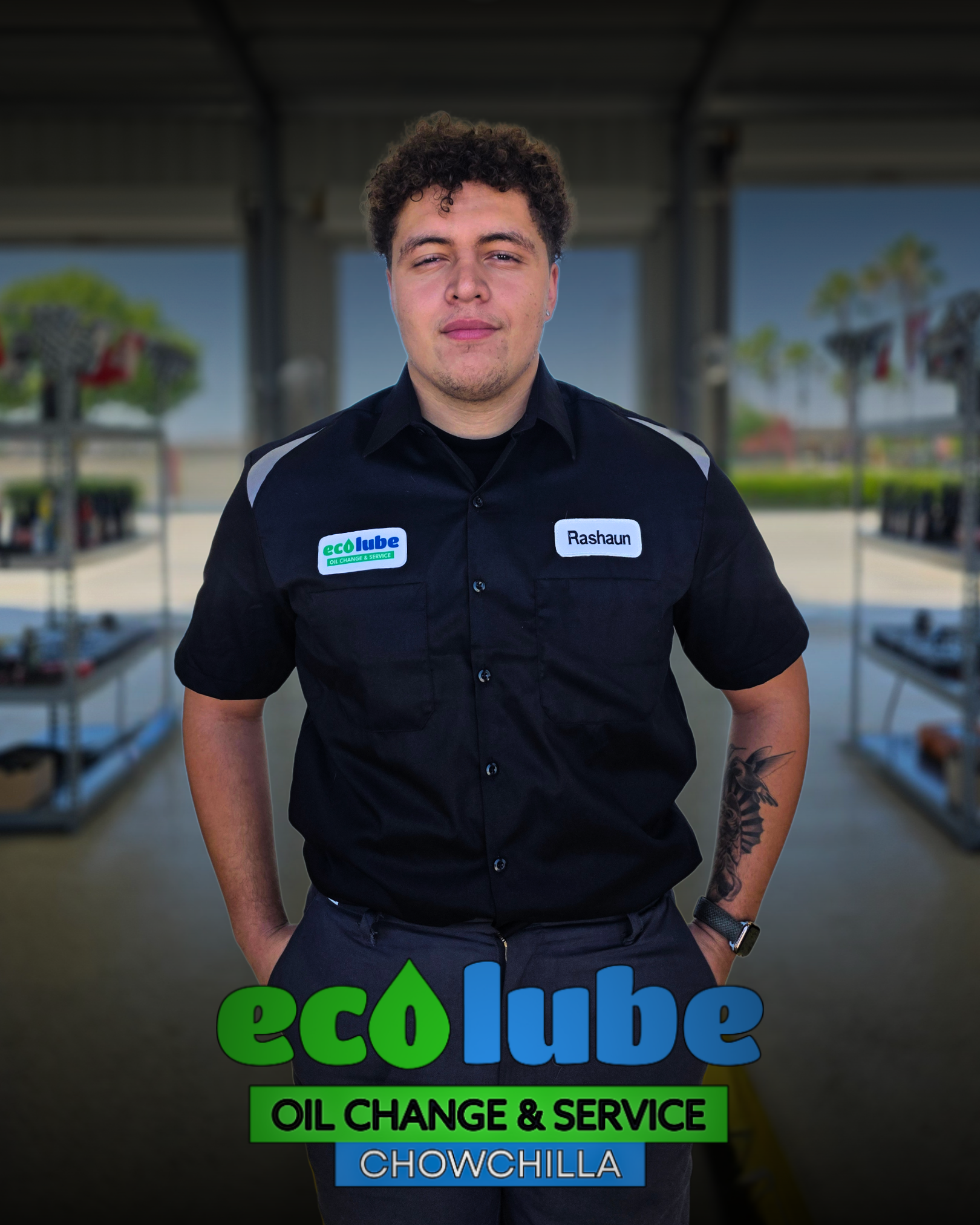 Man in uniform at Eco Lube oil change shop with arms crossed. Logo: green and blue "eco Lube" and "OIL CHANGE & SERVICE."