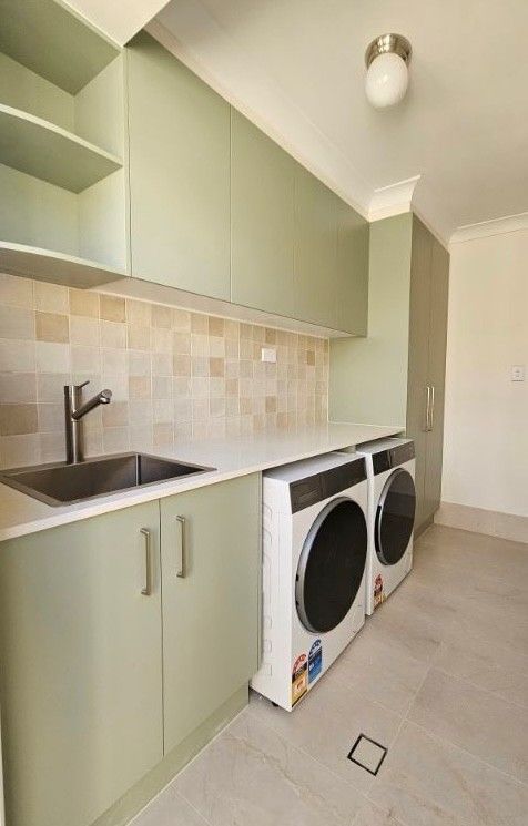 Custom laundry renovation with built-in cabinetry