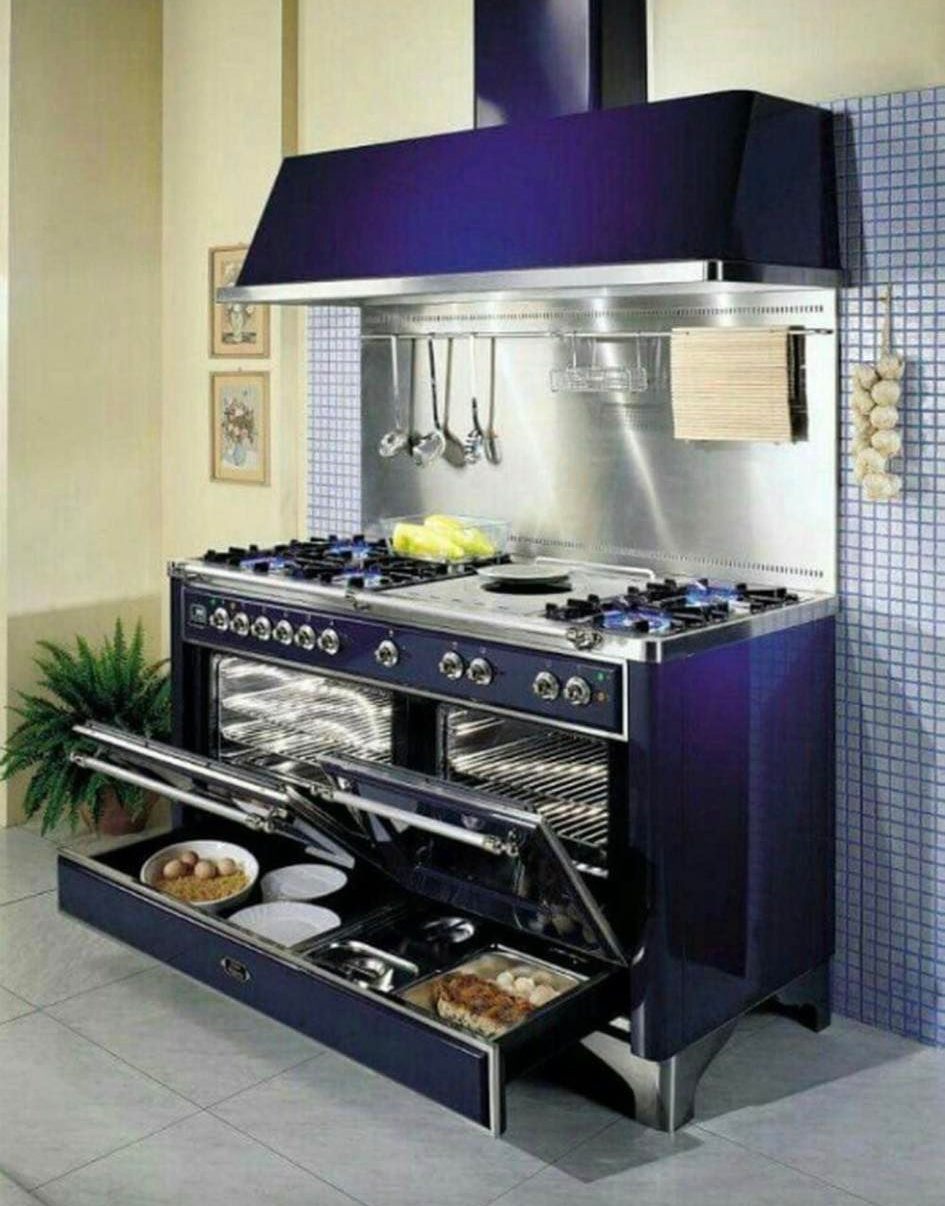 Purple outdoor kitchen grill island with stainless steel counter, grill, and shelving