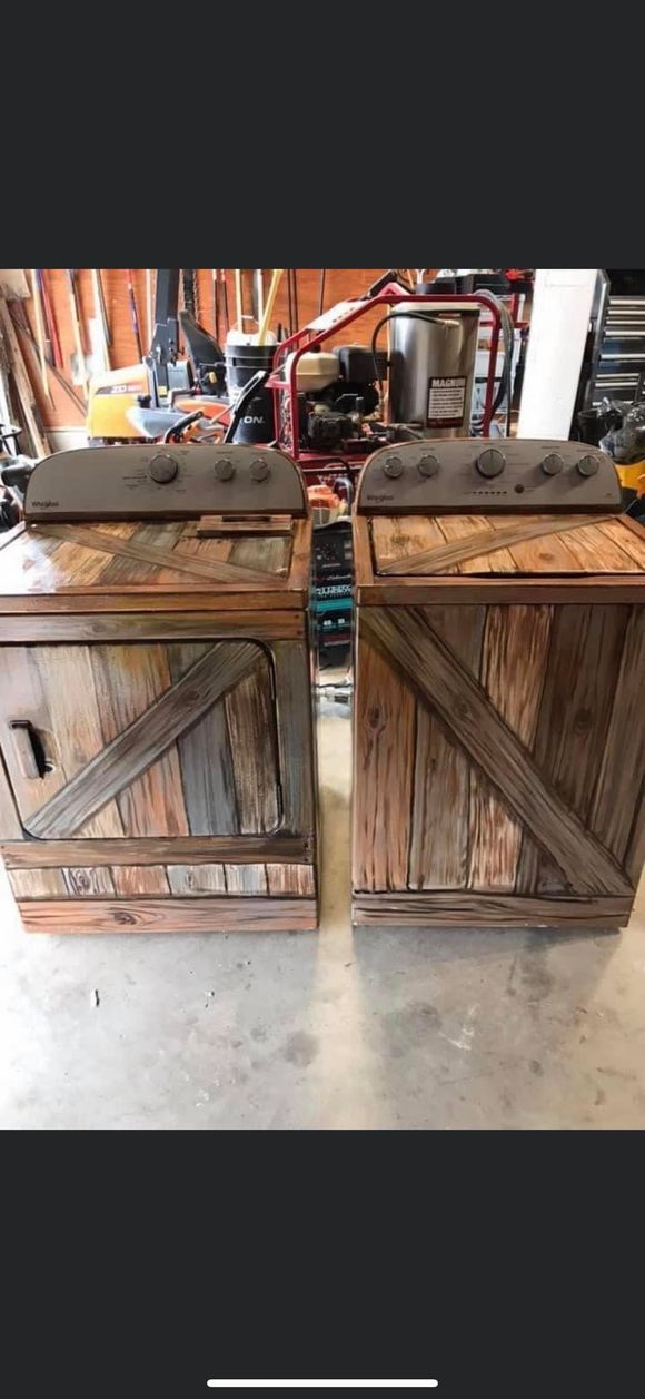Two rustic wooden crates with diagonal slats on a concrete floor in a workshop-like setting