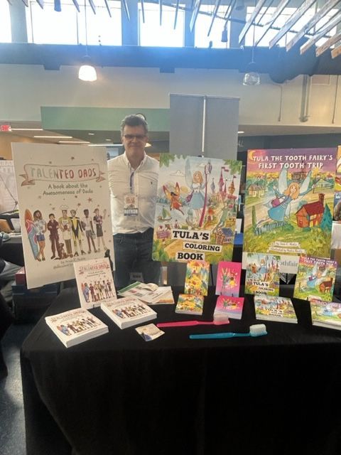 Sean and daughter at a book fair