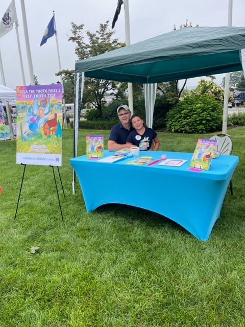 Sean and daughter at a book fair