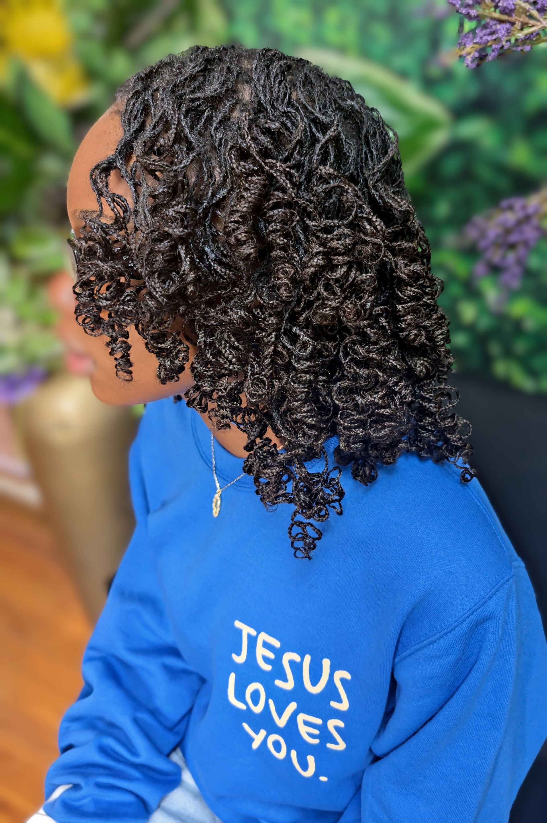 A person wearing a blue sweatshirt with 