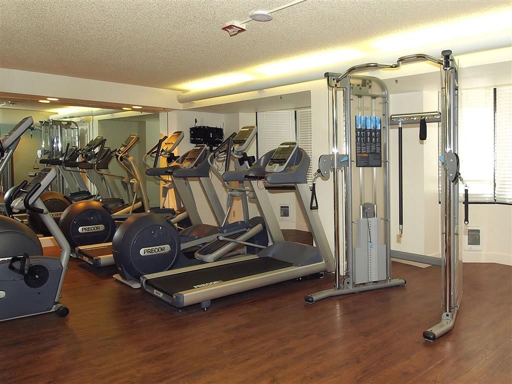 Indoor fitness center with treadmills, ellipticals, and weight machines at Tower 737, offering apartments in San Francisco, CA.