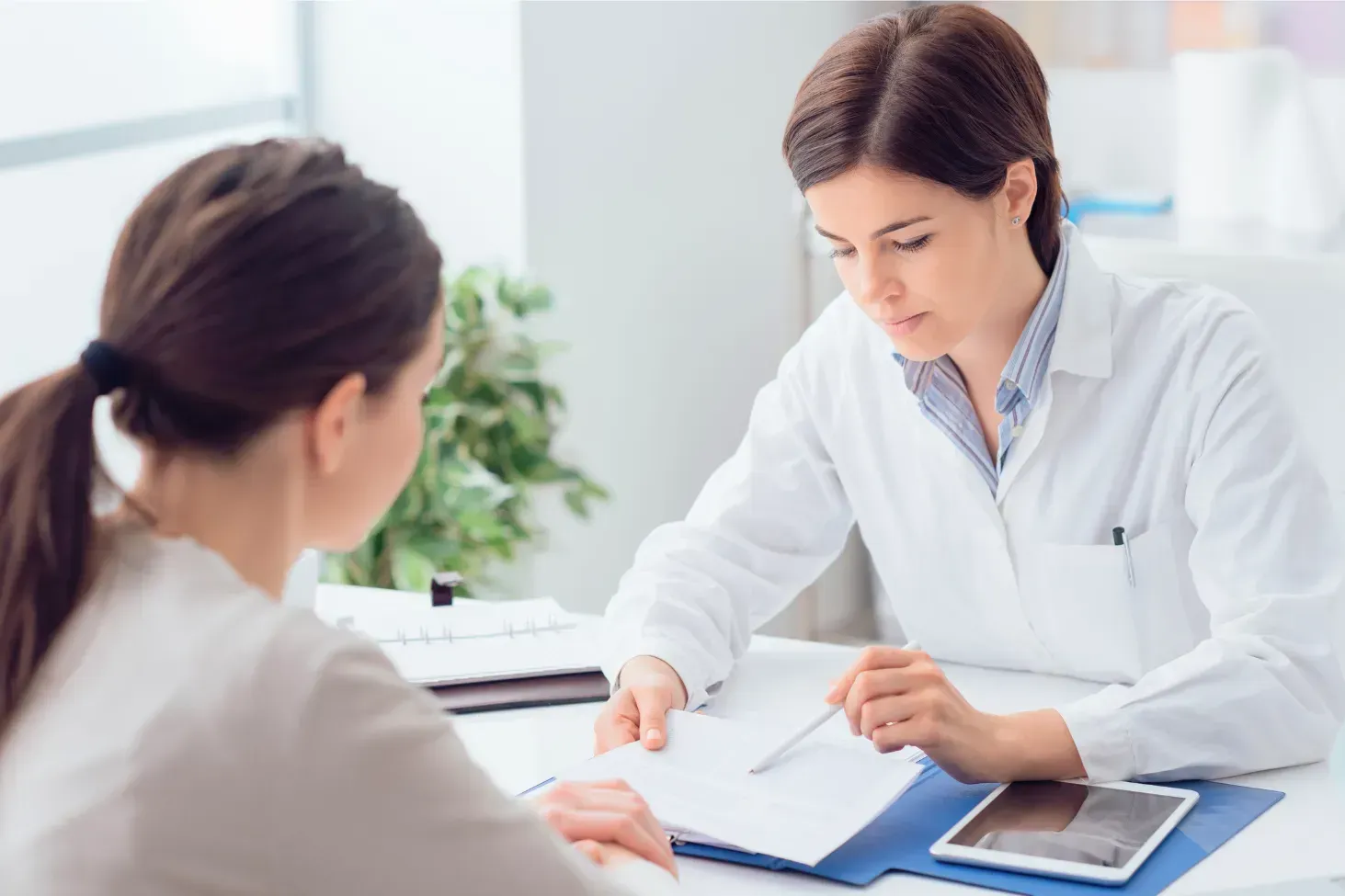 Patient speaking with a doctor about what to expect before an MRI scan