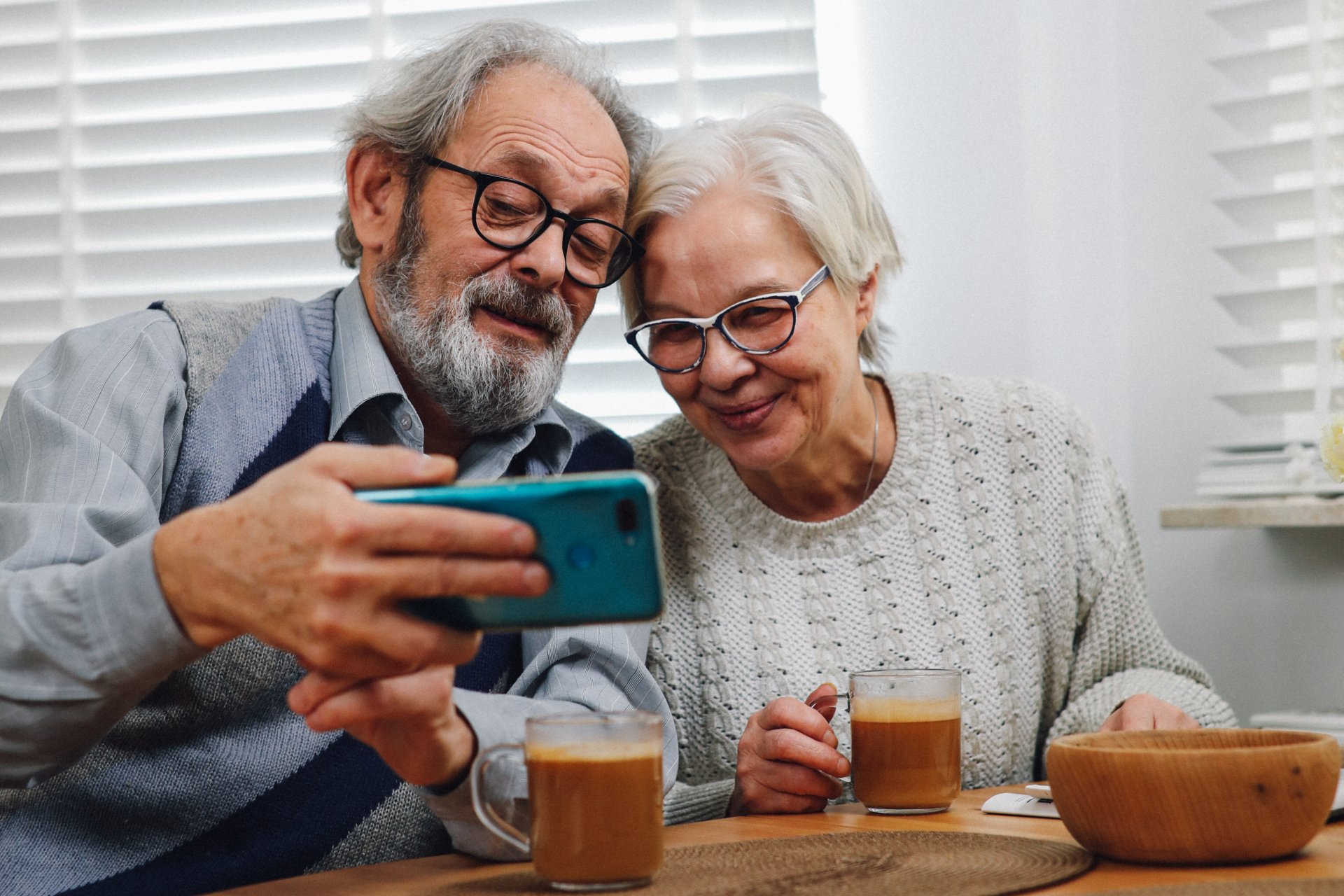 older couple taking a selfie