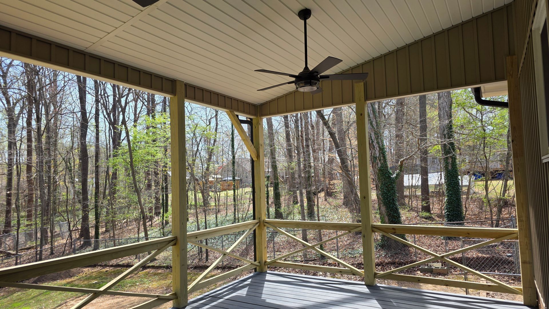 Bright sunroom featuring wood floors and panoramic windows