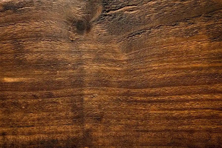 Brown wooden plank background with visible grain and knots
