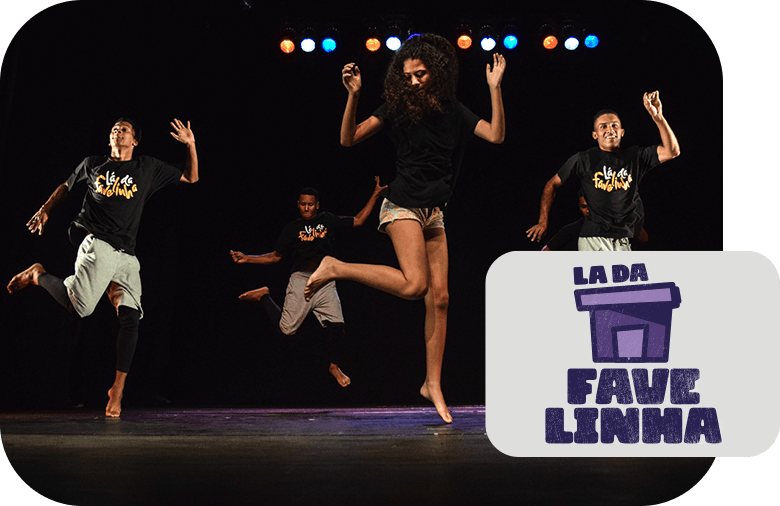 Four people with different characteristics from Grupo Lá da Favelinha dance on a stage.