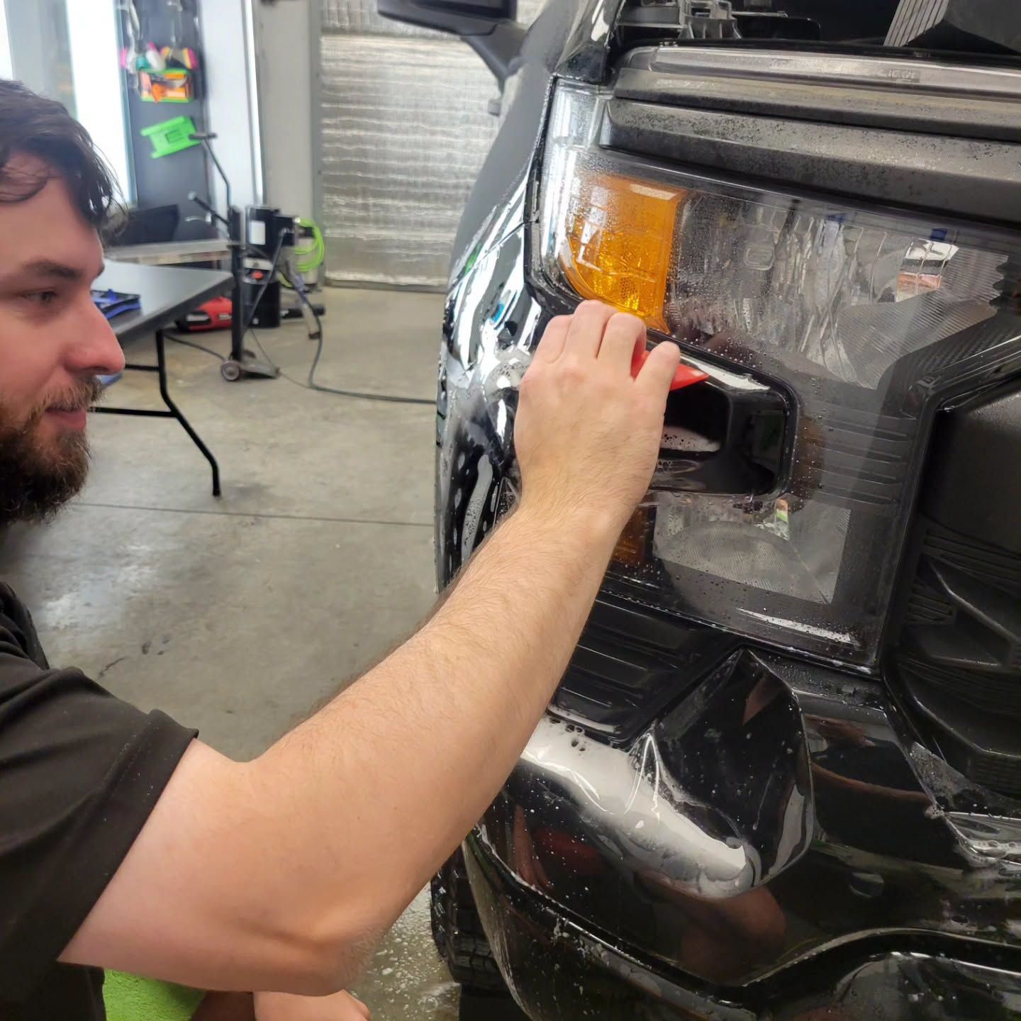 PPF installation on a truck’s front headlight and bumper.