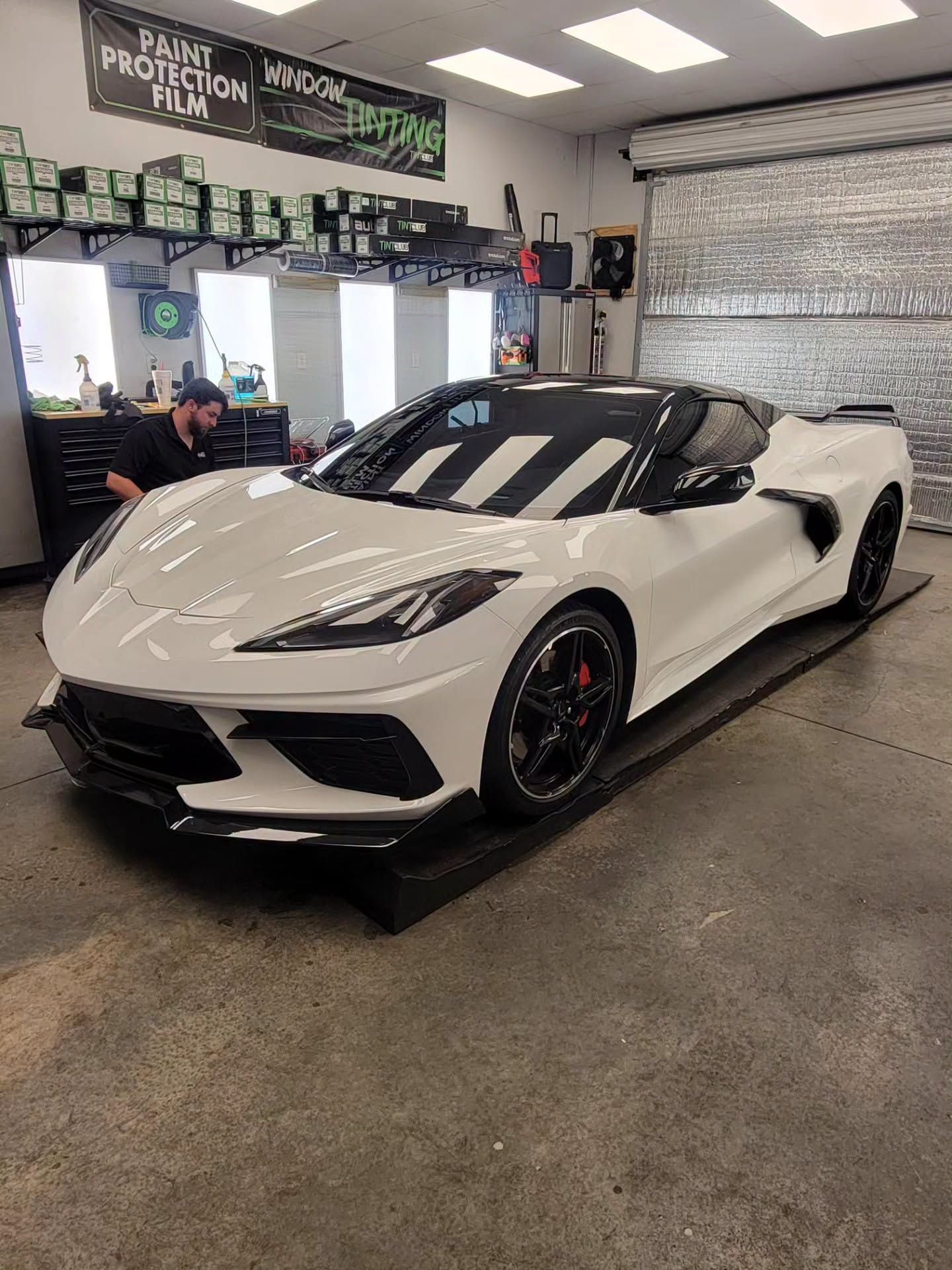 White sports car with a glossy ceramic coating finish.