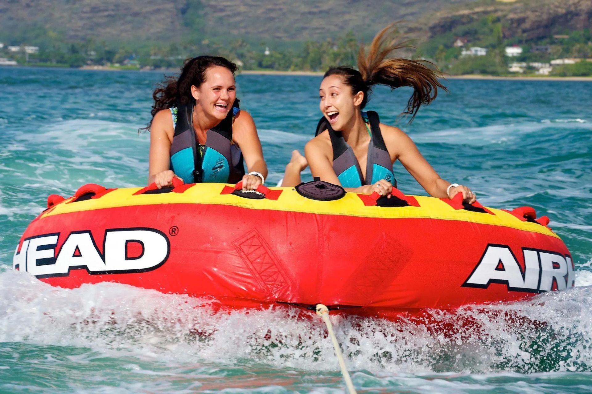 Two people on a bumper tube