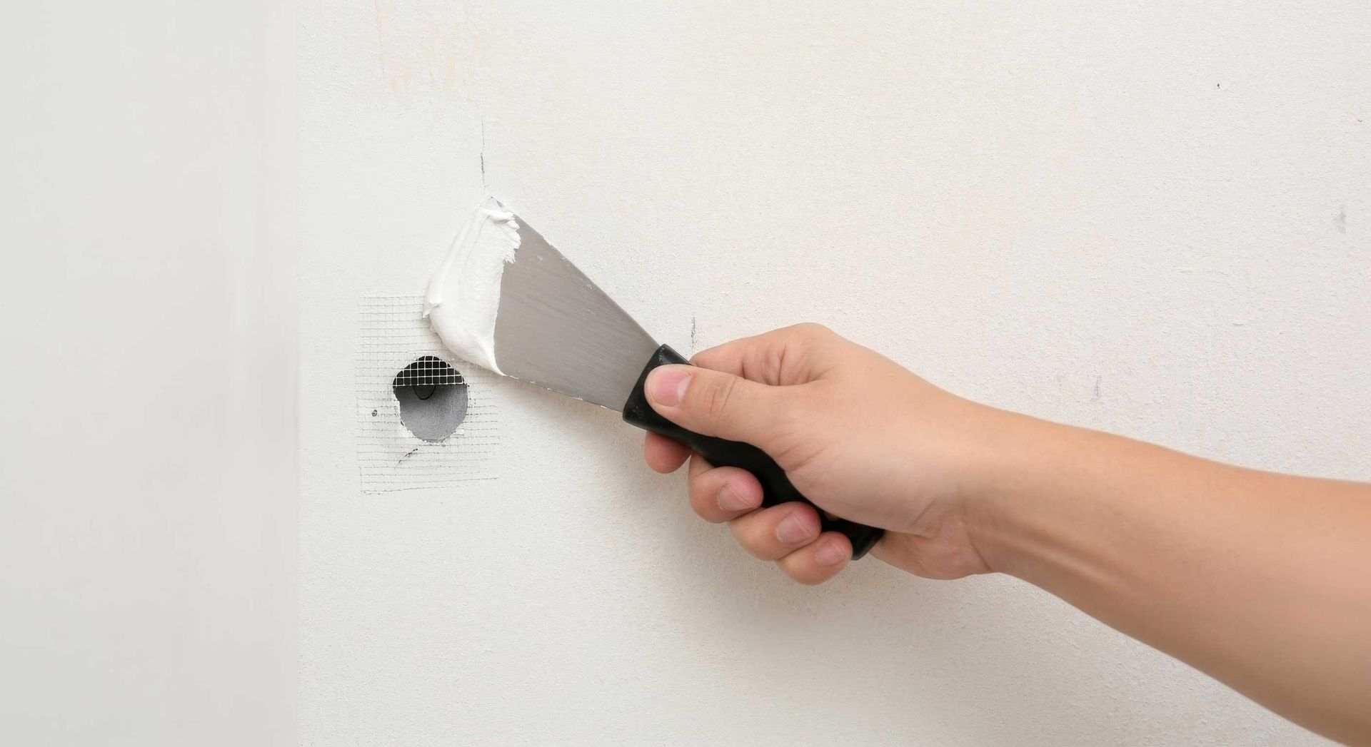 Small Plasterboard Hole Being Patched in a Toowoomba Home