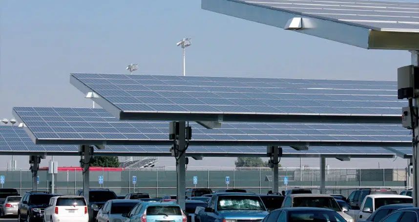 Solar-panel canopy over parked cars in a parking lot