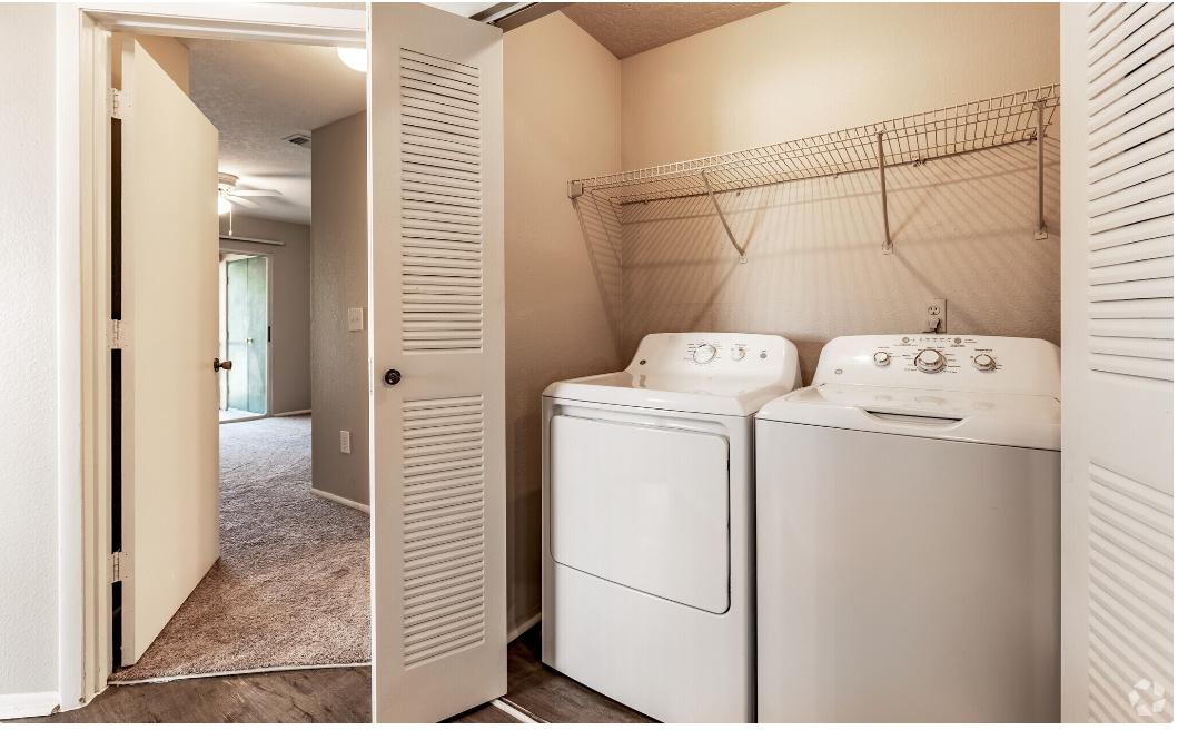 a laundry room with a washer and dryer in it