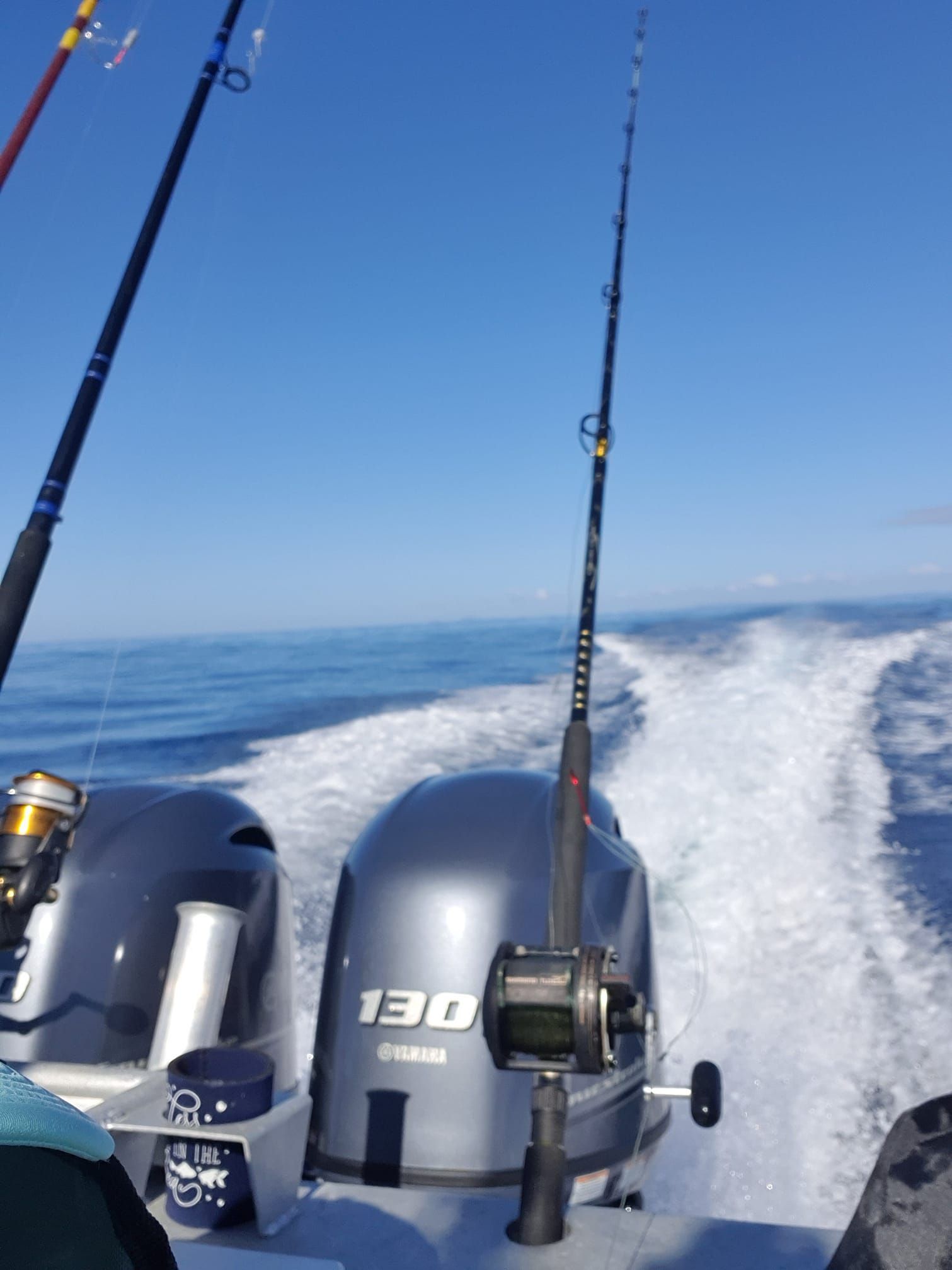 fishing rod sitting on the side of a boat — Boat Service in Woodburn, NSW