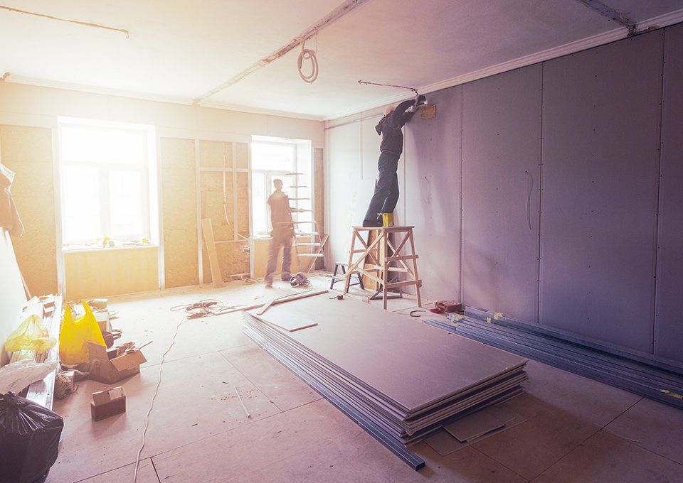 Workers Are Installing Plasterboard — Uniontown, PA — Sagada Construction