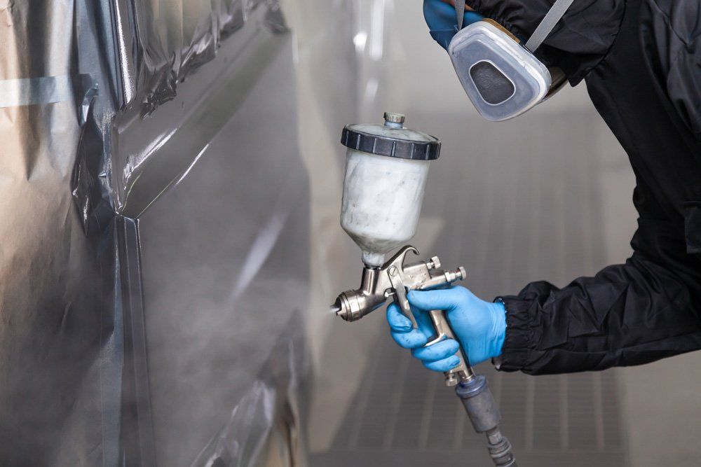 Spraying Grey Paint — Hobart, TAS — Hobart Smash Repairs