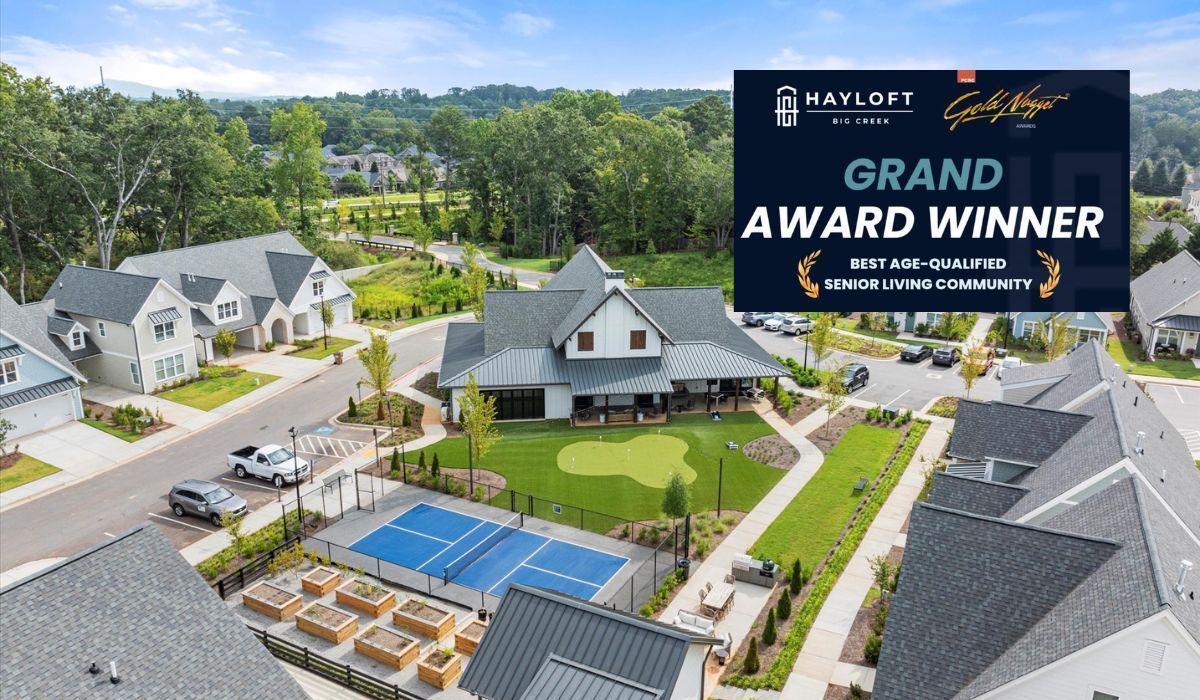 Hayloft Grand Award Winner banner with senior living community and clubhouse photo