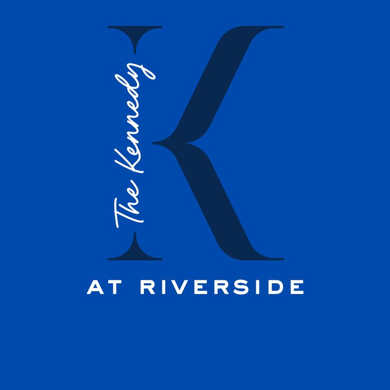Blue logo reading “The Kennedy at Riverside” with a large stylized K.