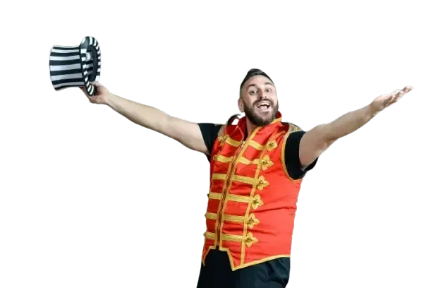 A man in a circus costume is holding a top hat with his arms outstretched.