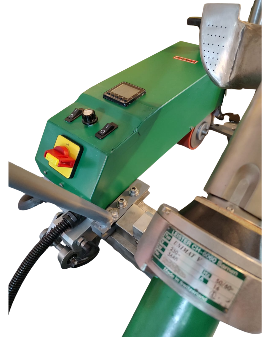 Green plastic welding machine with a red switch and control panel.