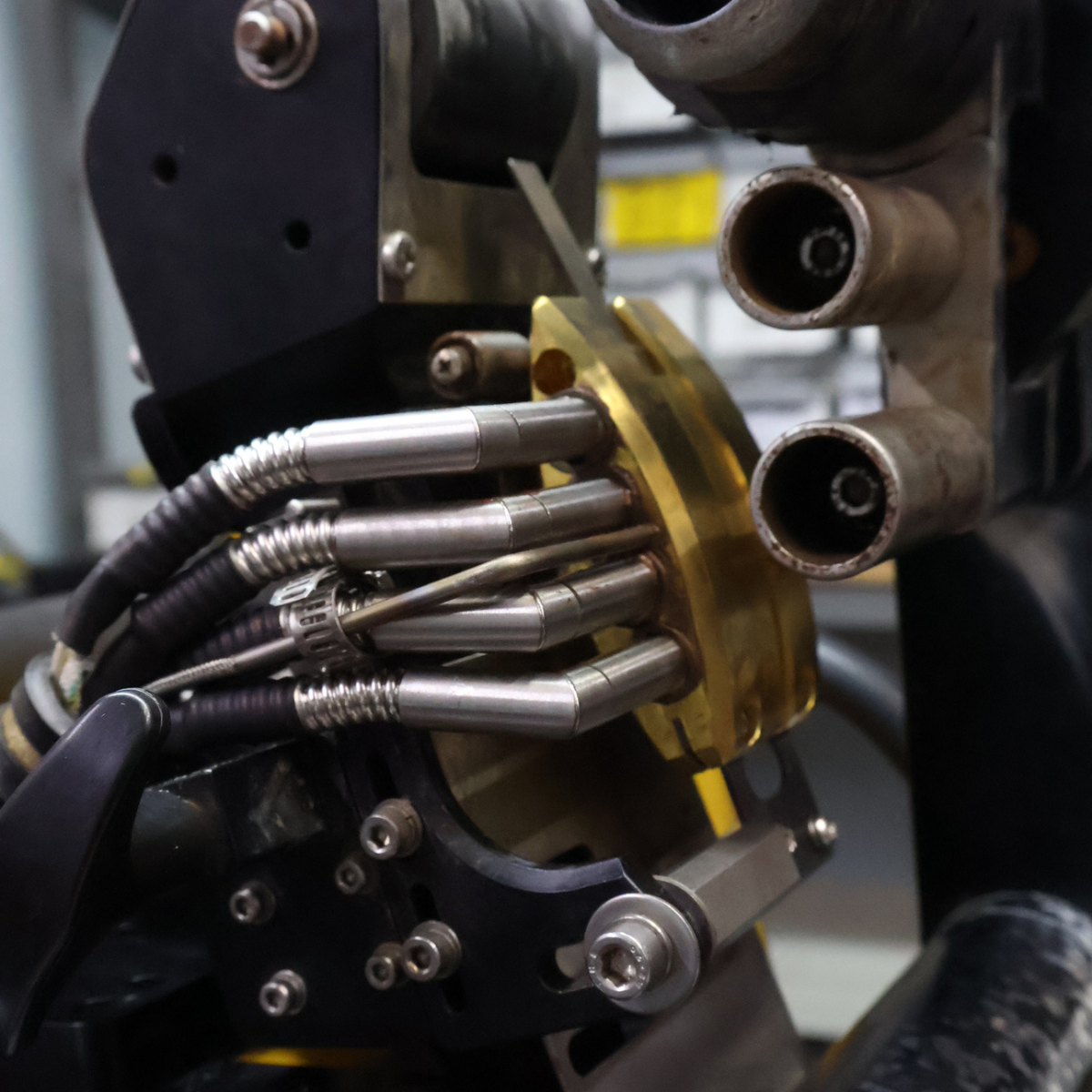Person uses a heat gun to weld a white material to a gray surface.