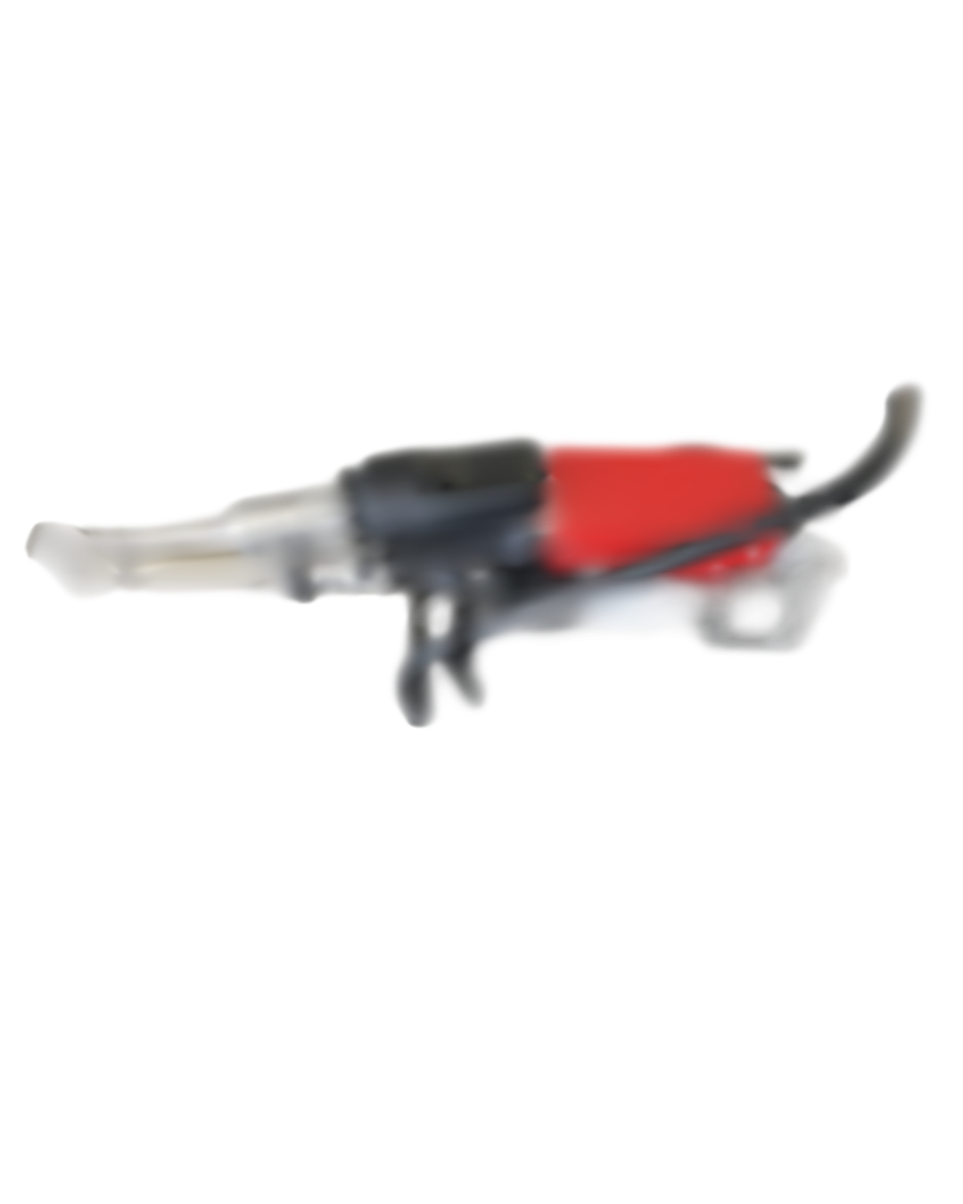 Red and black power tool, possibly a jigsaw or cutter, on a white surface.