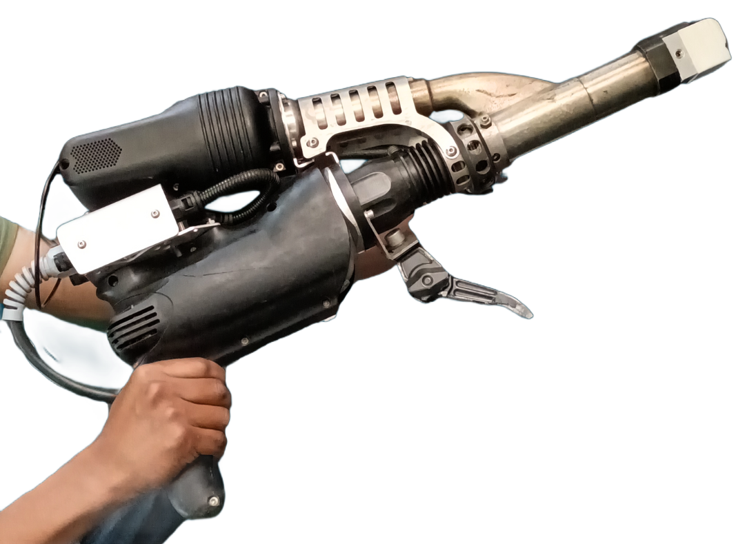 Person holding a black and silver welding tool with a trigger.