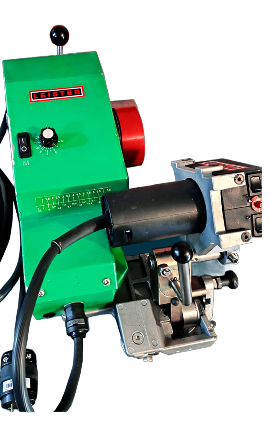 Green and black electrical machine with a red wheel and black handle.