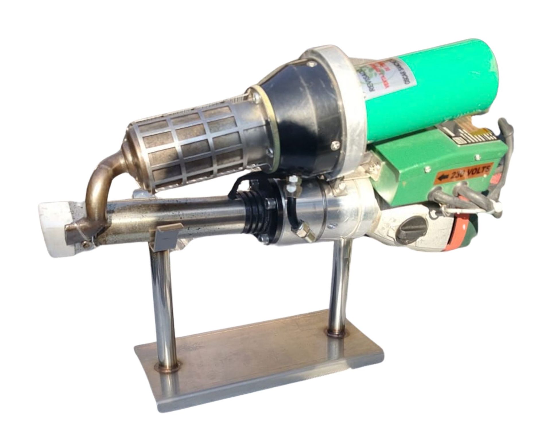 Plastic welding gun on a metal stand; features a green motor housing, black nozzle, and silver components.