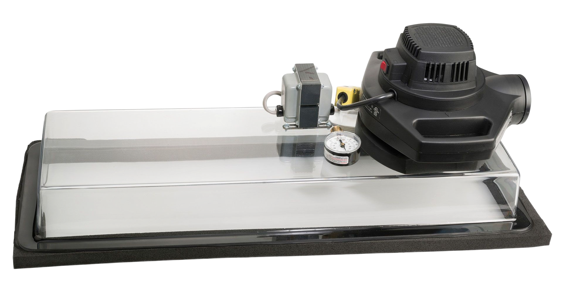 Vacuum forming machine with clear plastic mold on black base.
