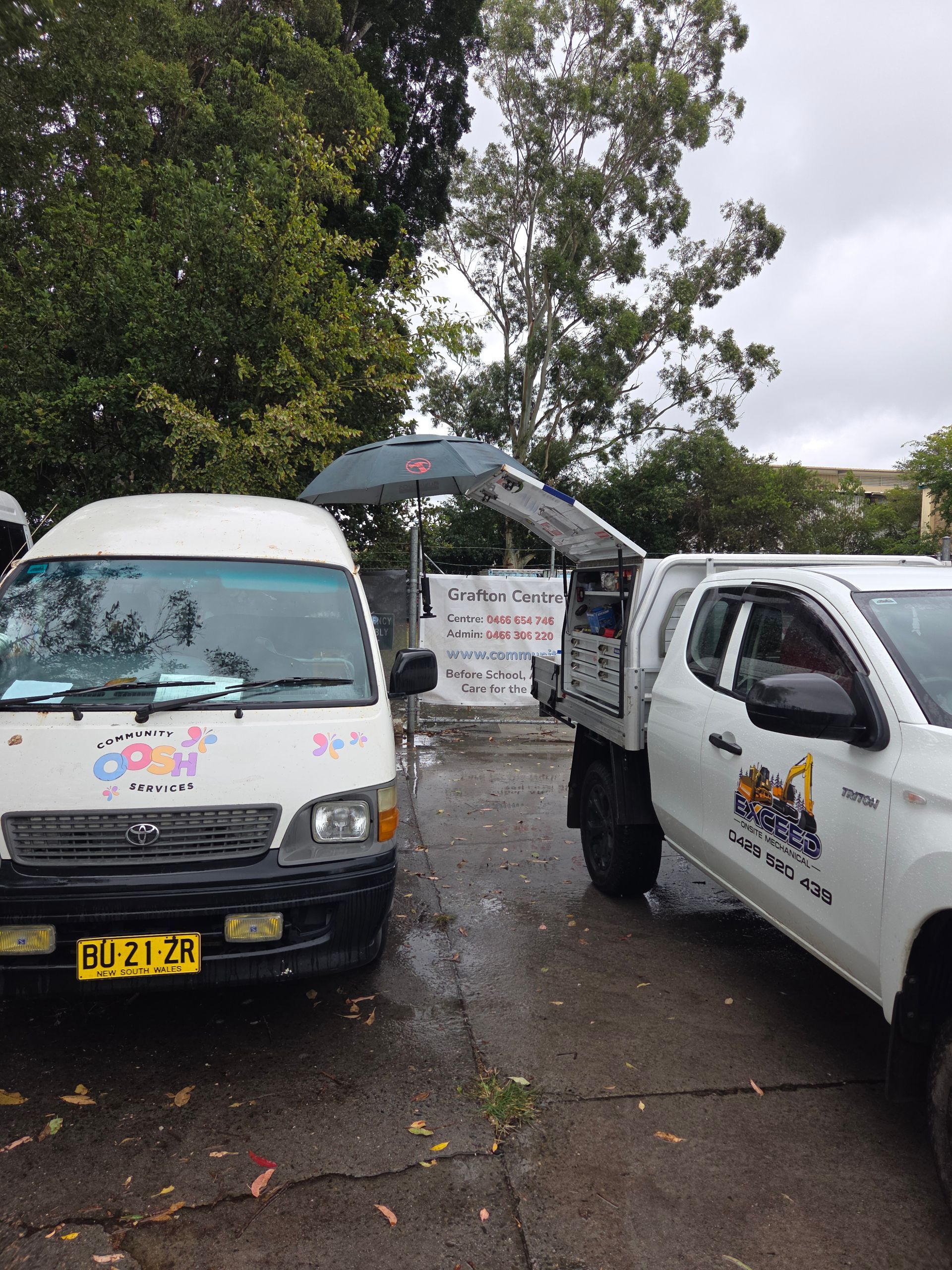 A white van and white utility truck parked outdoors — Exceed Onsite Mechanical in Grafton, NSW