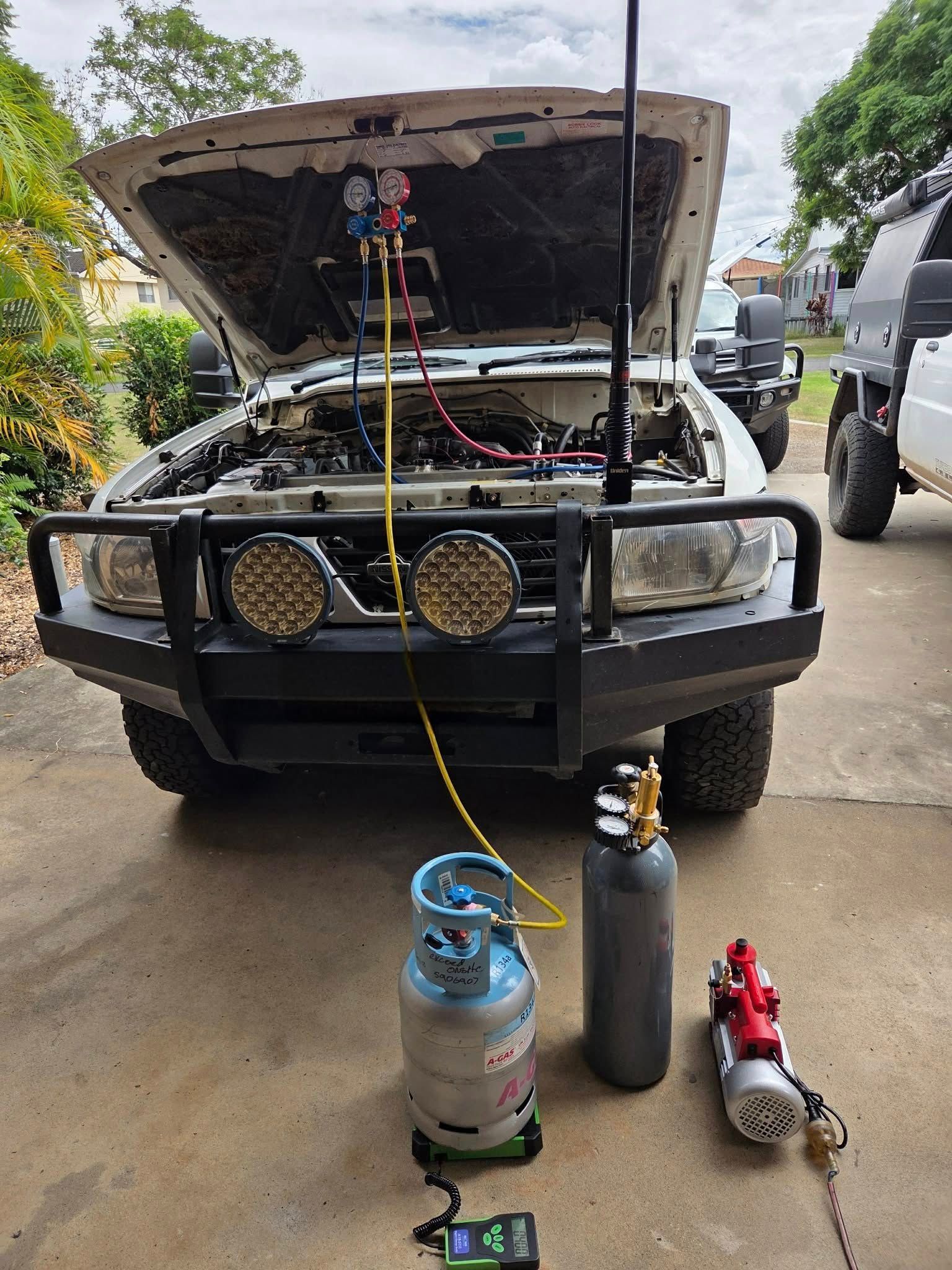 A Vehicle with Its Hood Open Hooked to AC Manifold Gauges — Exceed Onsite Mechanical in Grafton, NSW