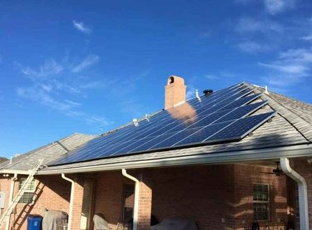 Solar panels installed on a shingle roof in West Texas