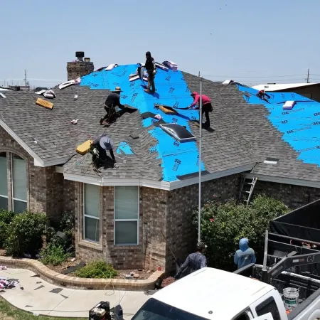 Grey asphalt shingle roof installation on residential home by Roofs by Nicholas in Texas