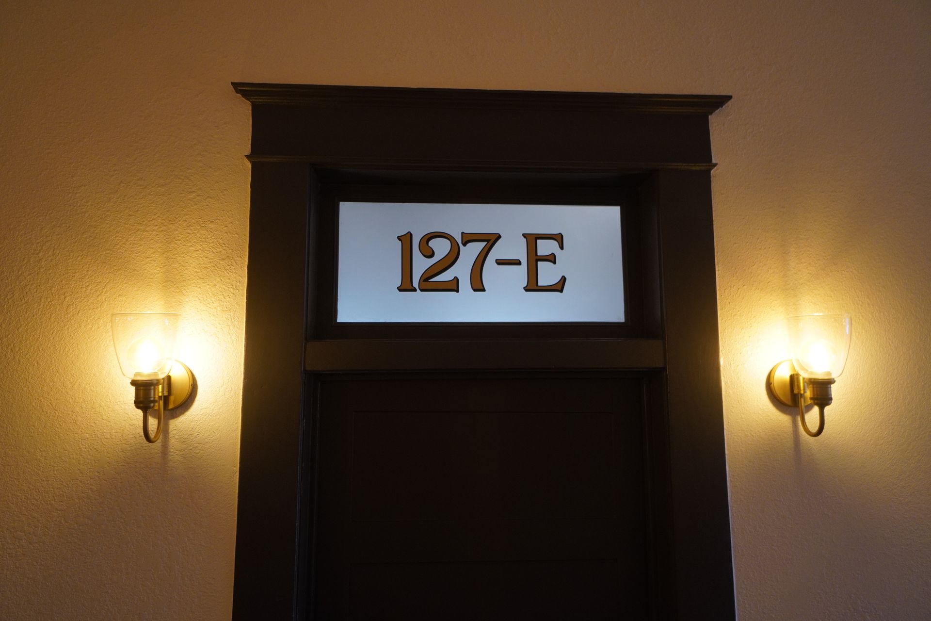 Doorway with illuminated room number 