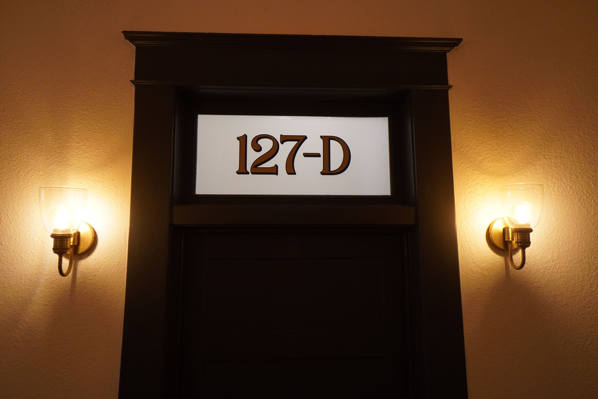 Doorway with illuminated room number 