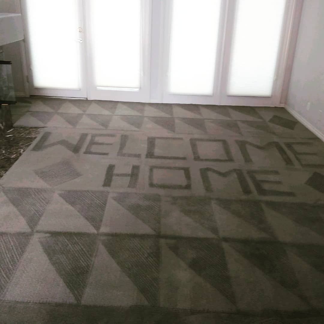Eco Friend Carpet Clean - A carpet with a geometric design and the words 