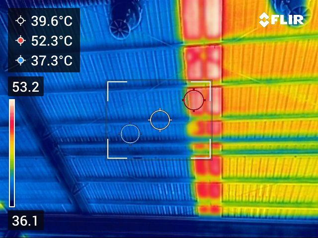 Thermal image of a ceiling showing temperature variations in blue to orange. Warmer areas around support beams.— Depinto Agencies In North Mackay, QLD