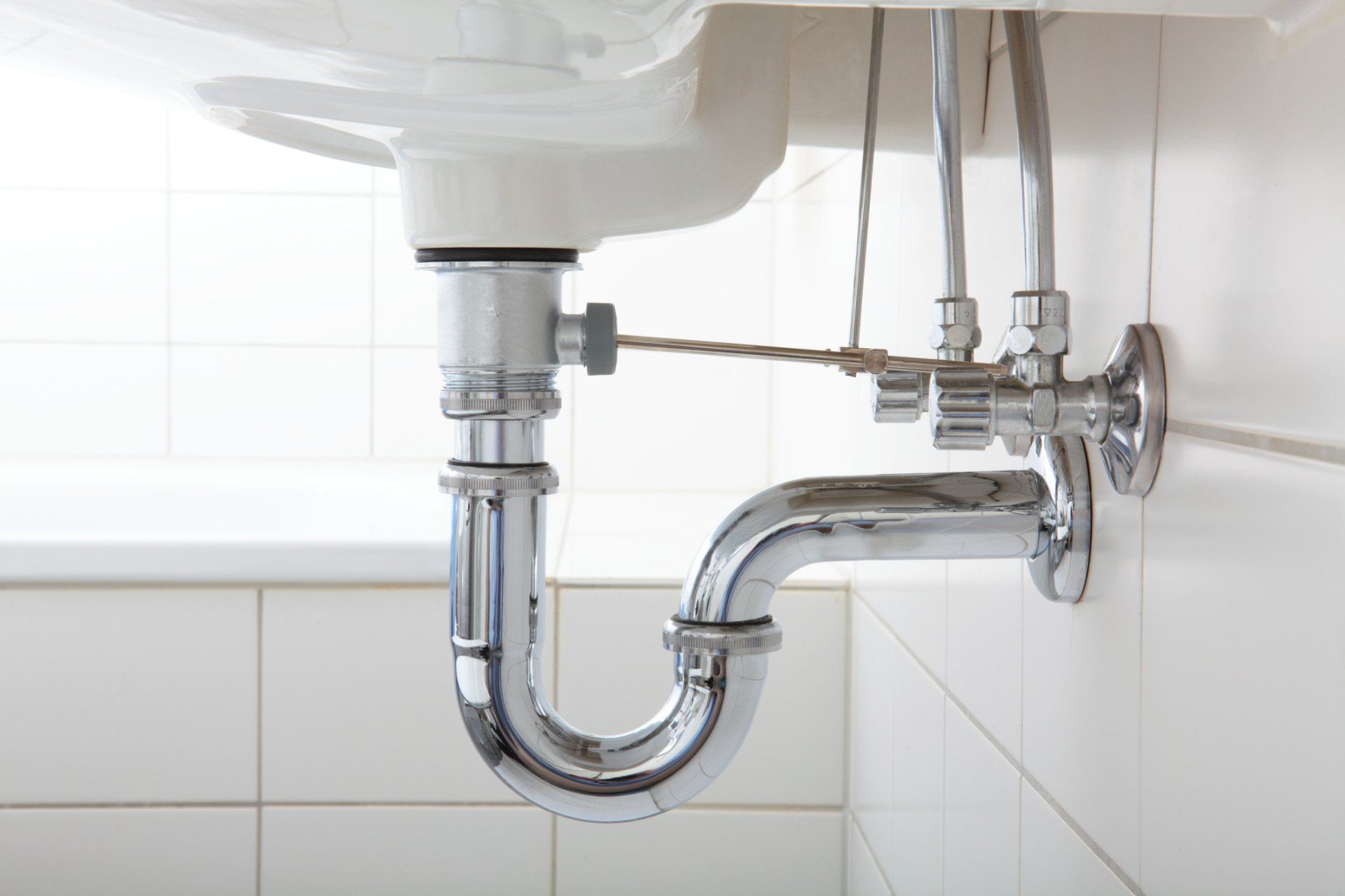 Plumber Fixing Sink | Duncansville, PA | Barton’s Plumbing & Heating Inc.